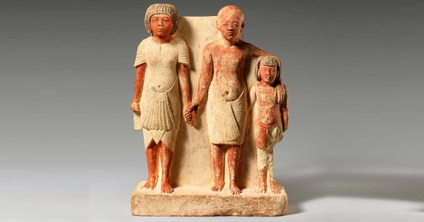 Egyptian statue of two men and a boy that served as a domestic icon. Source: The Metropolitan Museum of Art / Public Domain.