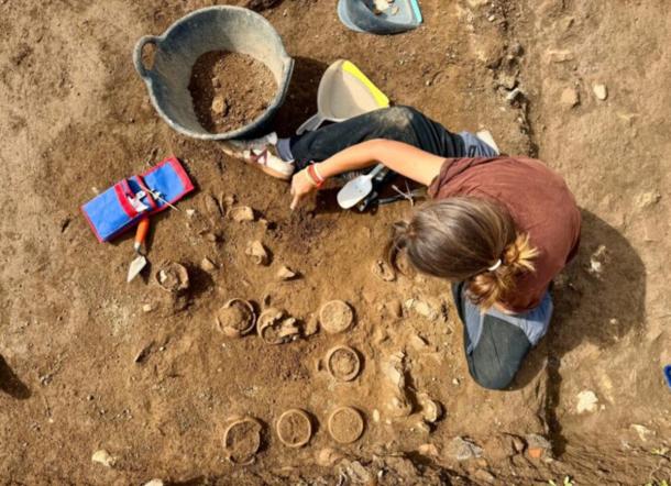 Archaeologist excavating ceramic pots at Hadrian's Villa.