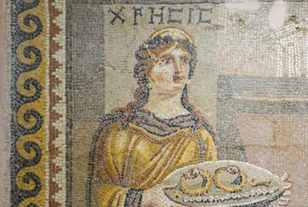 Detail of the Khresis mosaic, depicting a woman carrying a tray of jewelry from the Trojan War cycle. 