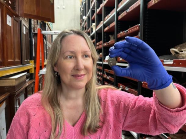 Kat Baxter, Leeds Museum and Galleries&rsquo; curator of archaeology and numismatics, shows the ancient coin.