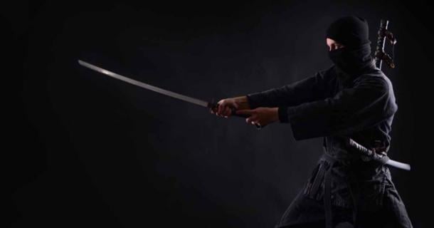 Ninja, samurai warrior on a dark background. Source: Dmytro/Adobe Stock