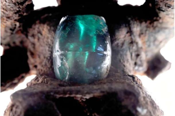 An emerald mounted on a copper pendant recovered from a Cocl&eacute; burial. 