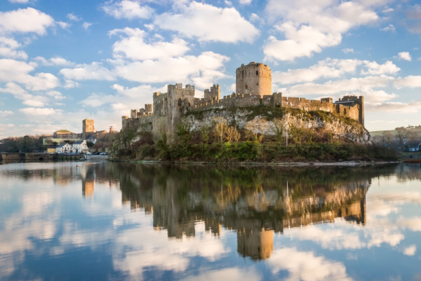 Pembroke Castle in Pembrokeshire, Wales. Archaeologists from the University of Aberdeen are excavating Wogan Cavern beneath the medieval fortress, where preserved sediments contain evidence of human occupation and environmental change stretching back more than 100,000 years