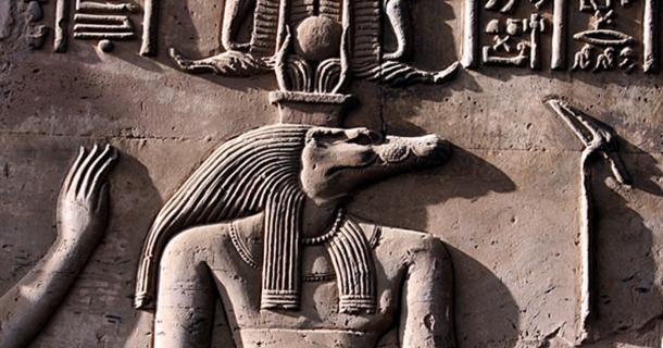 Close up of Sobek as represented on a relief from the Temple of Kom Ombo shows Sobek with typical attributes of kingship, including a was-scepter and royal kilt.