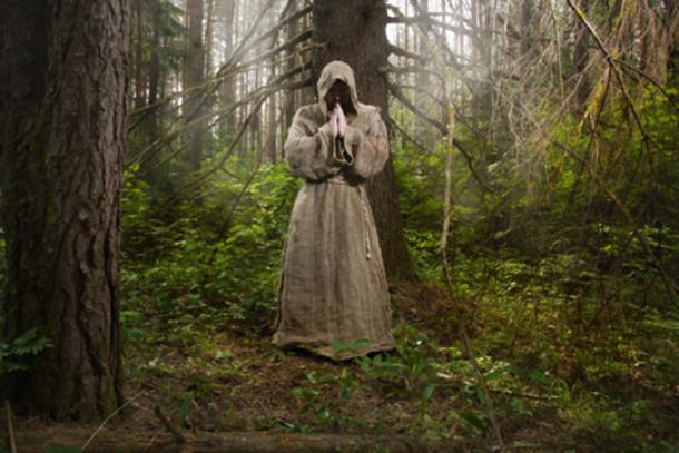 Monk in the forest Credit: Demian / Adobe Stock