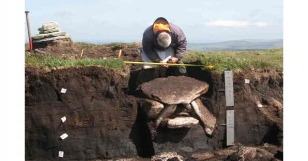 Archaeologists recording the previously found Bronze age cist burial at the Whitehorse Hill site. Source: Courtesy of Dartmoor National Park Authority via Devon Live