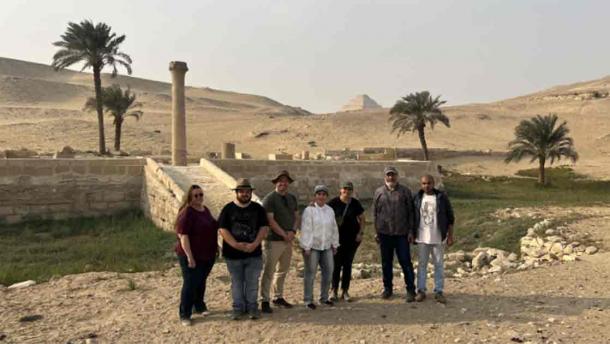 The research team stands in front of the pyramid of Unas’s Valley Temple, which acted as a river harbor in antiquity. Source: Eman Ghoneim/Nature