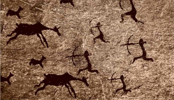 A cave art prehistoric hunting scene. Source: Maxim Chuev/Adobe Stock