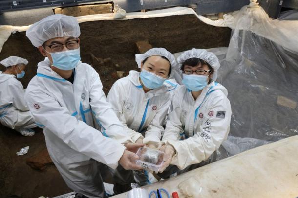 Researcher Li Nan, from Peking University, pictured with her team, holding the foot amputation evidence that was subjected to biomedical analysis. Source: South China Morning Post