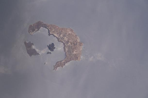 The ring-shaped islands of Santorini around its flooded volcanic caldera, photographed from the International Space Station