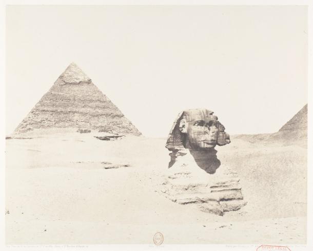 The Great Sphinx of Giza, buried to its shoulders in sand, with Khafre's pyramid behind it, in an 1851&ndash;52 photograph by F&eacute;lix Teynard