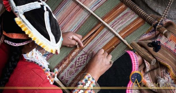 This woman is showing how local textiles are woven.