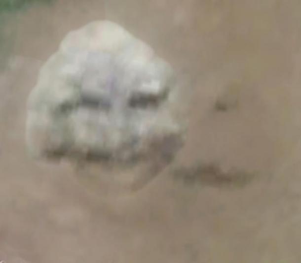 Figure 6. The Portal sculpture depicting the happy smiling face of the Viking Miner who likely owned the iron working site featured in Figure 3.