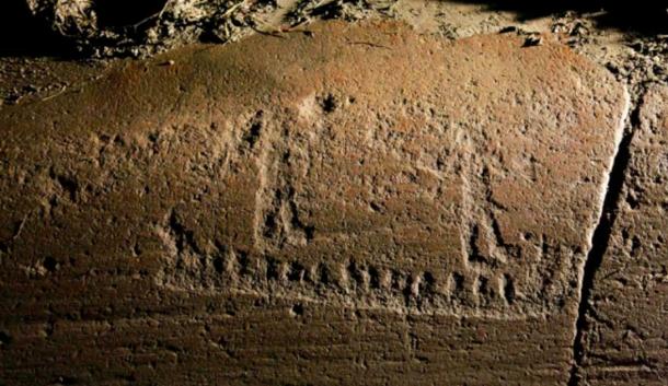 The figures on Norwegian rock carvings found in Fredrikstad, including a ship with two people raising their arms. One holds a cup mark, while the other spreads his fingers. (Fjeld, Klavestad, Tangen / Science in Norway)