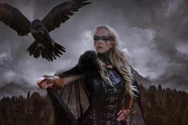 The falconry figurine could be depicting a man or a woman, but which is it? This image shows the Norwegian fjords and a Viking warrior woman a black crow as her attack 