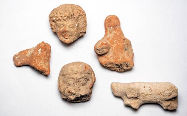 Clay figurines of women and animals found at the Arnona, Jerusalem excavation site. (Yaniv Berman / Israel Antiquities Authority)