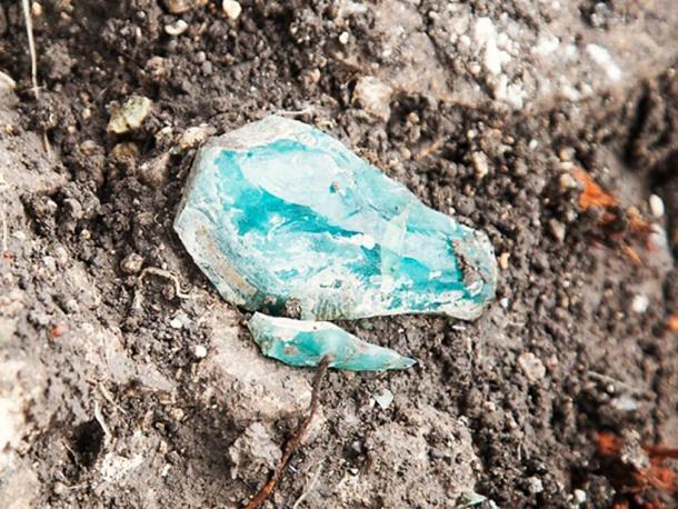 A fragment of the raw glass as it was found at the site. 