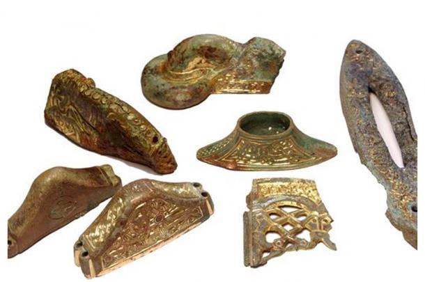 These elaborate, gilded sword handle parts found aboard the ships show the weapons may have been more for show than for battle. 