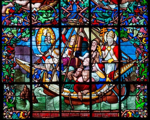 1857 stained glass artwork titled Espérance (hope) depicting the voyage of Matilda in 1145 from England to Normandy where, according to the legend of Chantereyne, Matilda, in the midst of a tempest that threatened the ship, promised to the Virgin Mary to build a chapel on the spot where she sets foot again on land. (Public Domain)