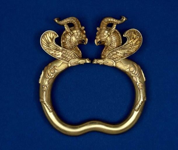 A gold armlet with griffin heads from the Oxus Treasure.