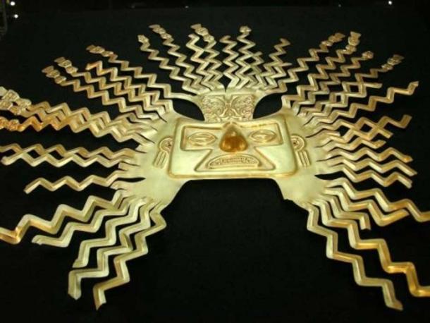 A gold-sheet mask representing the sun god Inti from the La Tolita part of the Inca empire. The design is typical of masks of Inti with zig-zag rays bursting from the head and ending in human faces or figures. National Museum, Quito, Ecuador