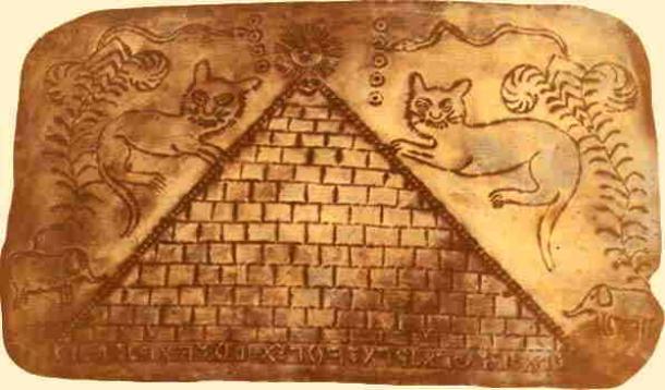 A gold sheet with a picture of a pyramid and Ethiopian letters at the foot of the pyramid. (Author provided)