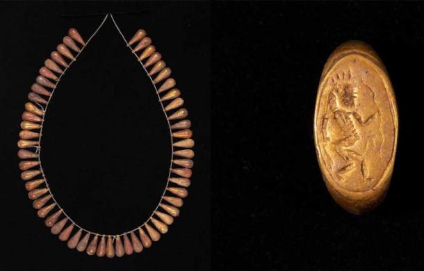 A gold tear-drop necklace and inscribed ring are a part of the bounty. (MOTA)