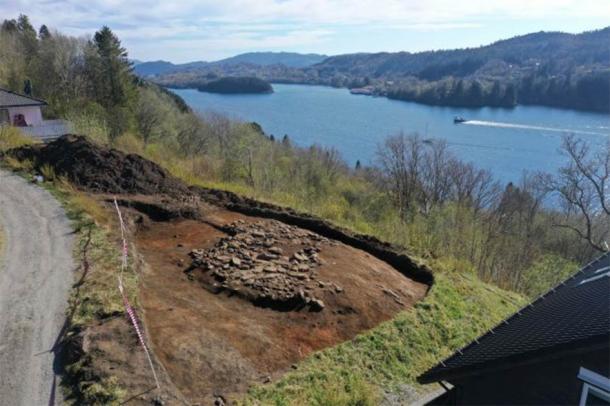 The grave cairn was discovered on a cliff overlooking the Alverstraumen strait. (University Museum of Bergen)