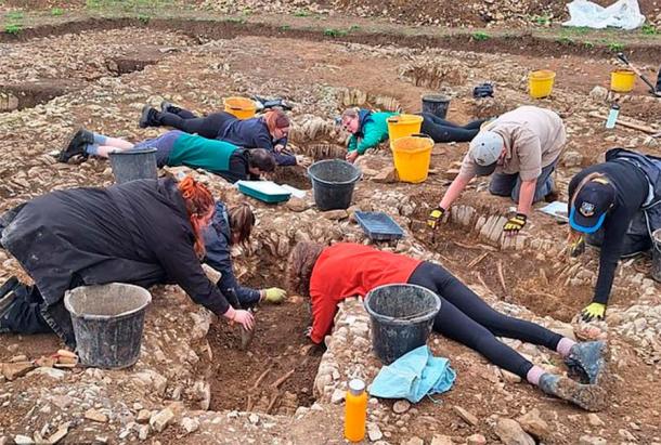 A group of archaeologists and students excavating the medieval cemetery at the Fonmon Castle site. (©Andy Seaman)