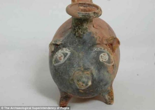 The 'guttus,' a bottle adorned with human-like eyes and terracotta balls in its belly, transforms into a rattle once a baby finishes its meal, all thanks to this whimsical vessel. (Archaeological Superintendency of Puglia)