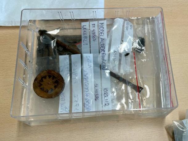 The hoard of game pieces are currently bagged, tagged and stored at the excavation field offices. (NIKU)