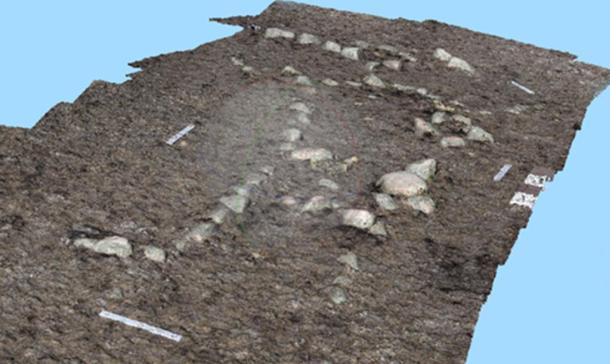 This human-made rock formation, an effigy photographed from a drone, depicts a human being.