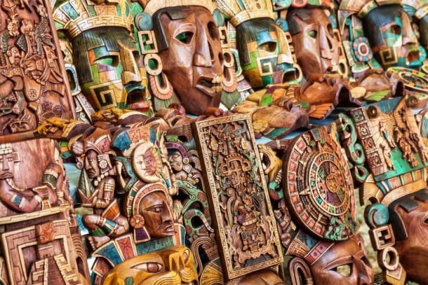 Maya wooden handcrafted masks in a traditional Mexican market. (Jose Ignacio Soto / Adobe stock)
