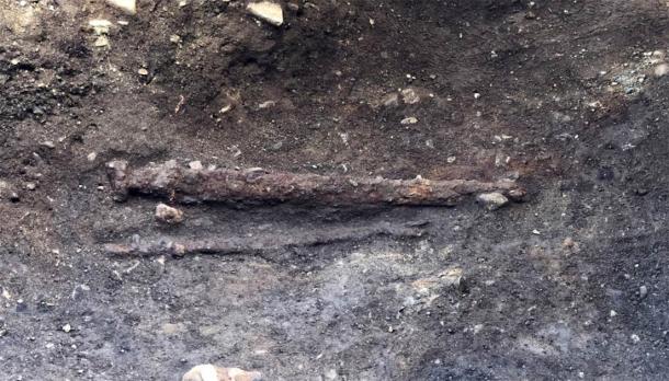 Swords are usually placed on the right side of the body in weapon graves like this. In this grave, it was laid on the warrior’s left side. (Ellen Grav Ellingsen / NTNU University Museum)