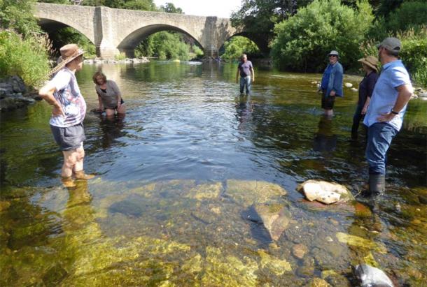 The “lost” medieval bridge was discovered by a multi-disciplined community of Scottish history lovers, seen here wading in the River Teviot. Thanks to their dedication, the Ancrum Old Bridge dating back to the 1300s was discovered in the Scottish borders. (ADHS)