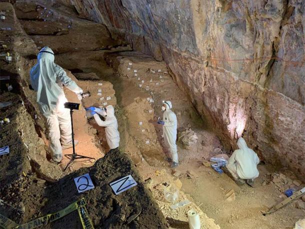 Assistant professor Mikkel Winther Pedersen with team members carefully sampling the different cultural layers in the cave. (Image: Mads Thomsen / Nature)