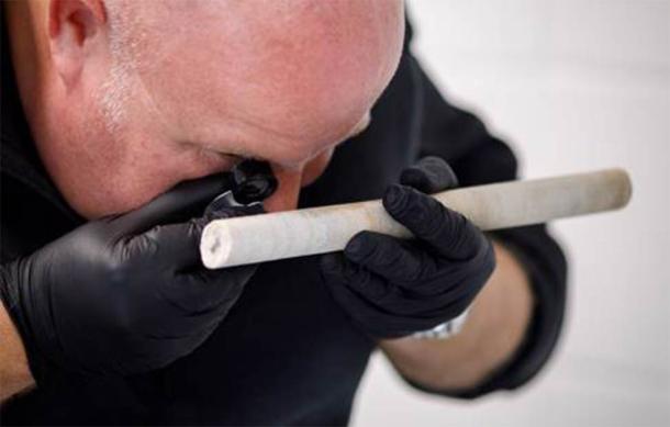 Professor David Nash analysing the sarsen core extracted from Stone 58 at Stonehenge. (Image: Sam Frost, English Heritage)