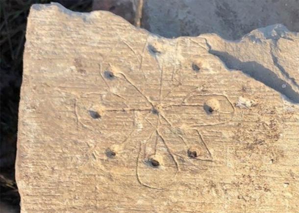 Stone with engraving of a circle from St Mary’s Church, Stoke Mandeville. (HS2 Ltd)