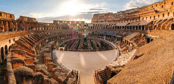 Panoramic view of Roman colosseum interior at sunset. (Martin M303 /Adobe Stock)