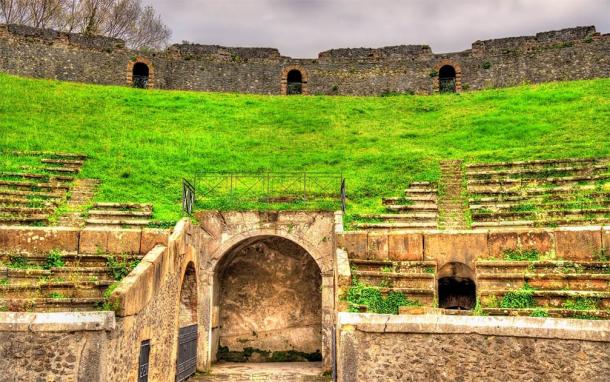The tunnels and tiered seating of Pompeii’s Amphitheater (Leonid Andronov / Adobe Stock)