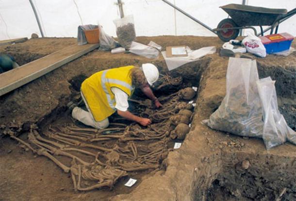 Excavating the mass burials at St Mary Spital. (MOLA)