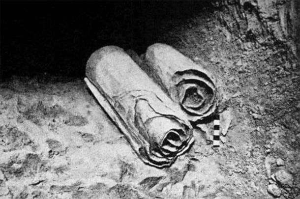 Two scrolls from the Dead Sea Scrolls lie at their location in the Qumran Caves before being removed for scholarly examination by archaeologists. ( Public Domain )