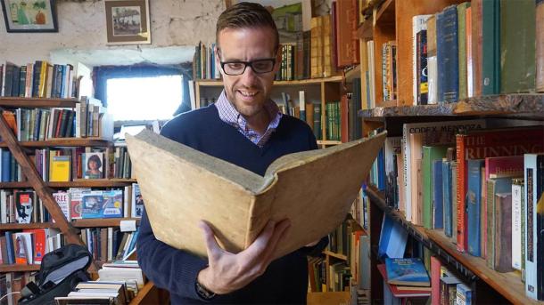 The author reading through some faerie tales in an old bookstore found at Hill of Tara. (Provided by the author)