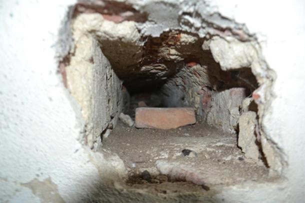 Notice the small hole in the wall against the toilet shaft. What was the purpose of a straight horizontal tunnel into the toilet shaft? (Author provided)