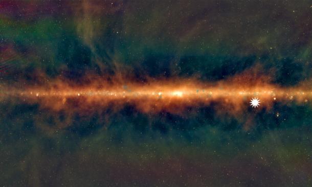 This image shows a new view of the Milky Way from the Murchison Widefield Array, with the lowest frequencies in red, middle frequencies in green, and the highest frequencies in blue. The star icon shows the position of the mysterious repeating transient. Credit: Dr Natasha Hurley-Walker (ICRAR/Curtin) and the GLEAM Team. (ICRAR)