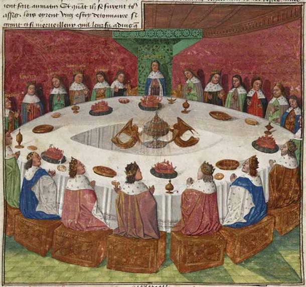 King Arthur's knights, gathered at the Round Table to celebrate Pentecost, see a vision of the Holy Grail. The Grail appears as a veiled ciborium, made of gold and decorated with jewels, held by two angels. From a 12th century manuscript (Public Domain)