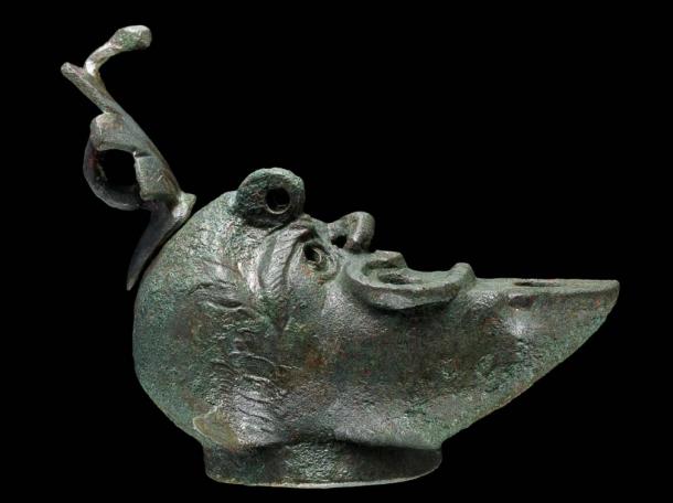 The lamp is designed with just half a face and a flat back