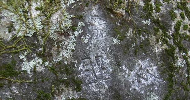 “This is a large boulder I call the Temple Stone carved with unusual symbols including a Maltese Cross.” Photograph © Dustin Naef 2016