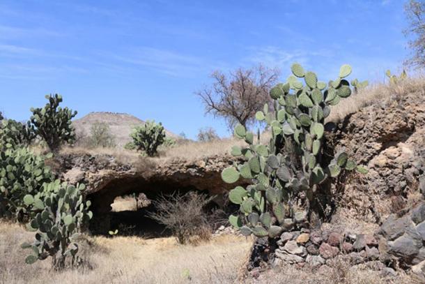 The location of the main cave system, a few hundred meters to the East of the Pyramid of the Sun (visible in the distance)
