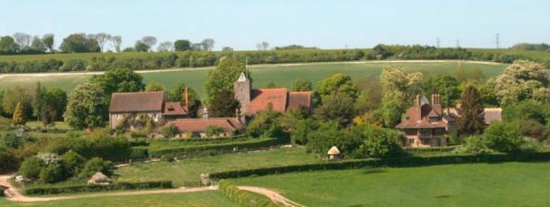 A view across the meadows to Luddesdown Church , with Luddesdown Court on the left, and Court Lodge on the right